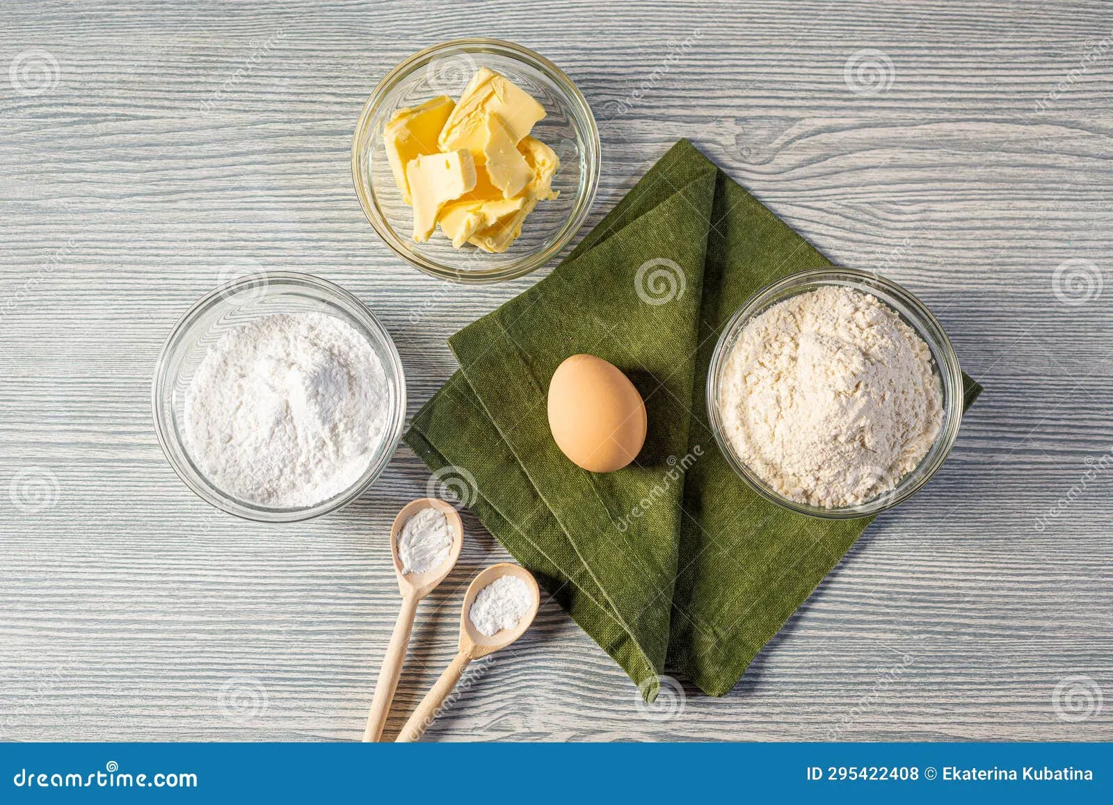 Ingredients for chocolate bird nests including chocolate chips, sliced almonds, pistachios, and candy eggs