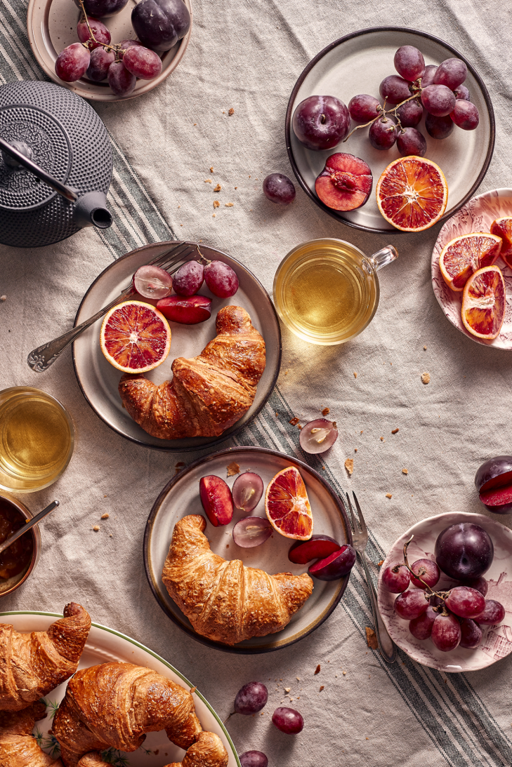 Ingredients for making crustless quiche including eggs, cottage cheese, fresh spinach, and cherry tomatoes